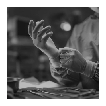 Artisan hands carefully shaping clay on pottery wheel in black and white workshop setting - in Clifton, NJ